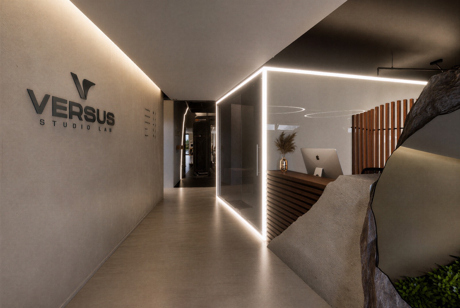 Corredor de entrada e receção do VERSUS Studio Lab com lettering em relevo